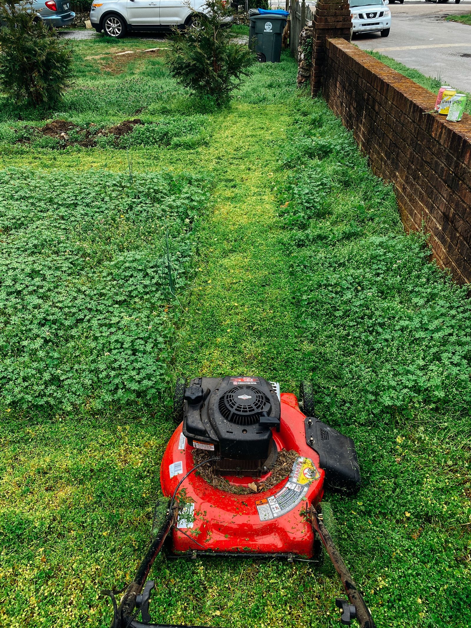 Lawn mower cutting grass during routine property maintenance